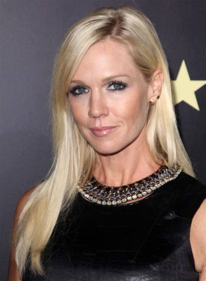 Jennie Garth At age 40 with long stylish hair tucked behind one ear